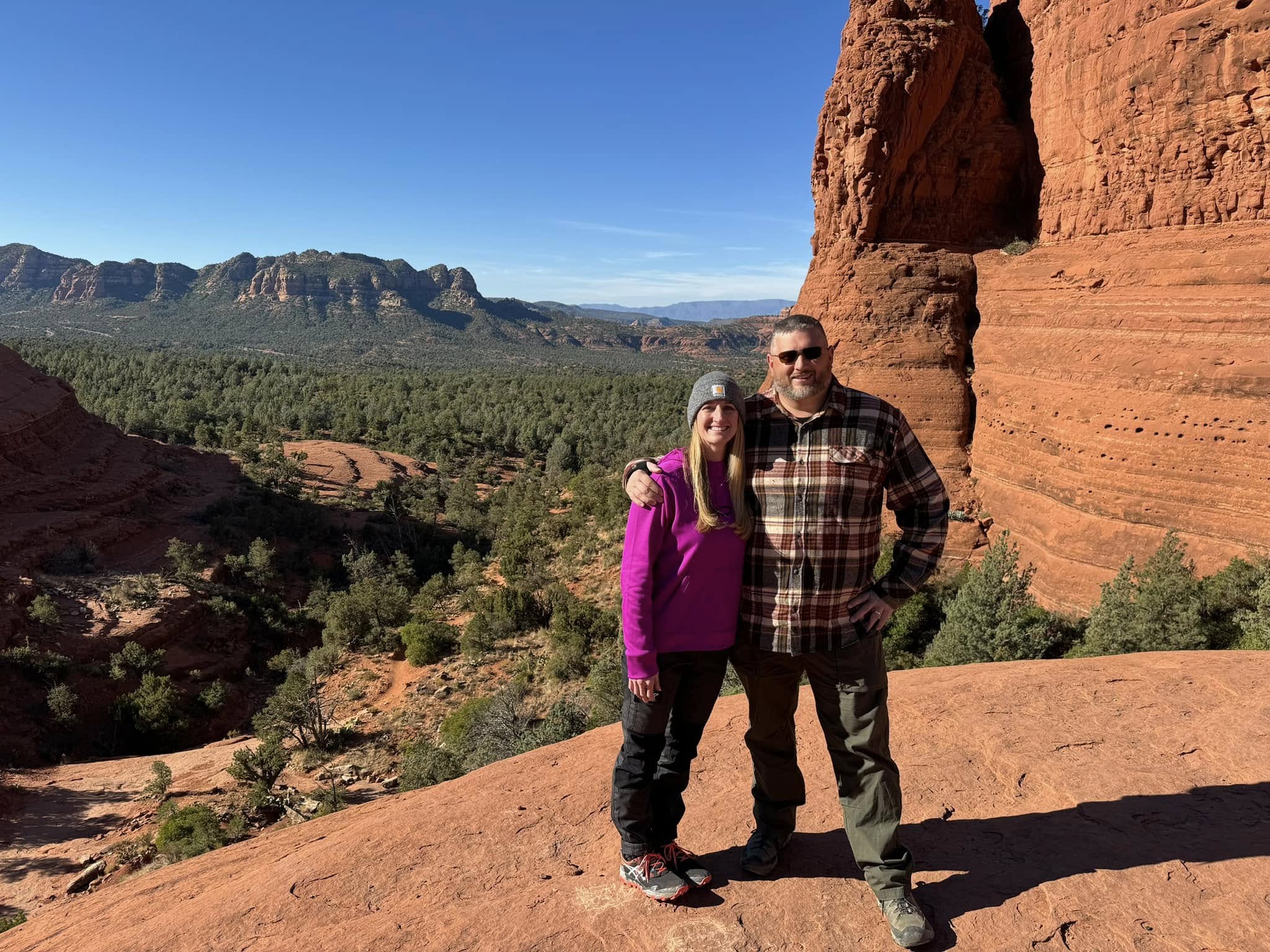 Daren and Lynn Sipes hiking among the red rocks of Sedona, Arizona