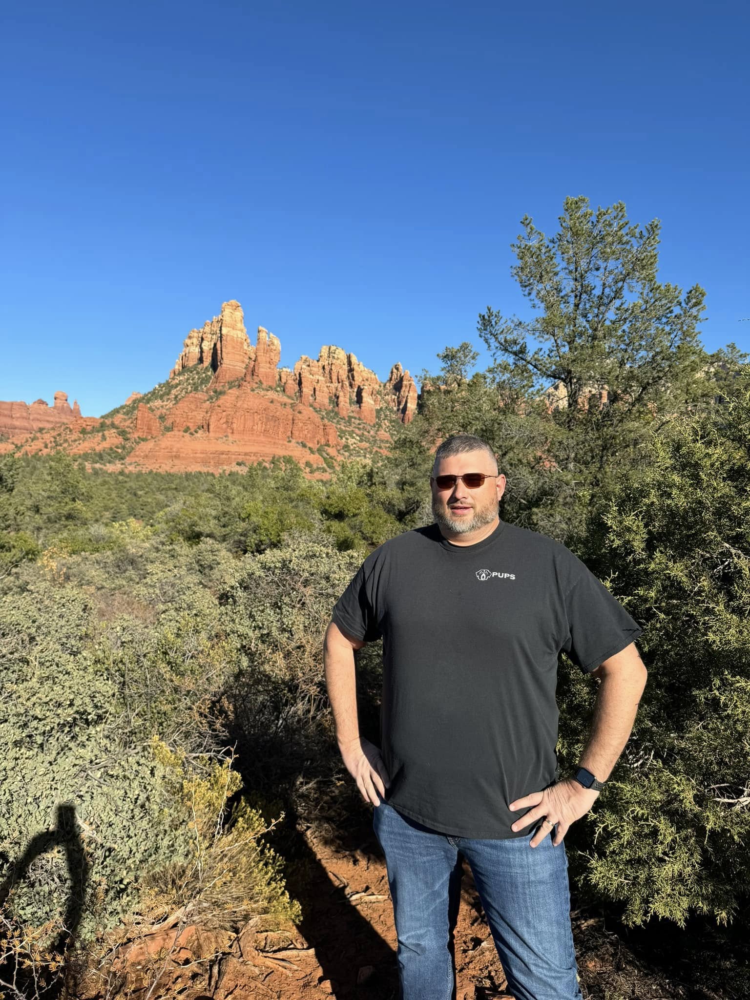Daren Sipes hiking among red rock formations in Sedona, Arizona